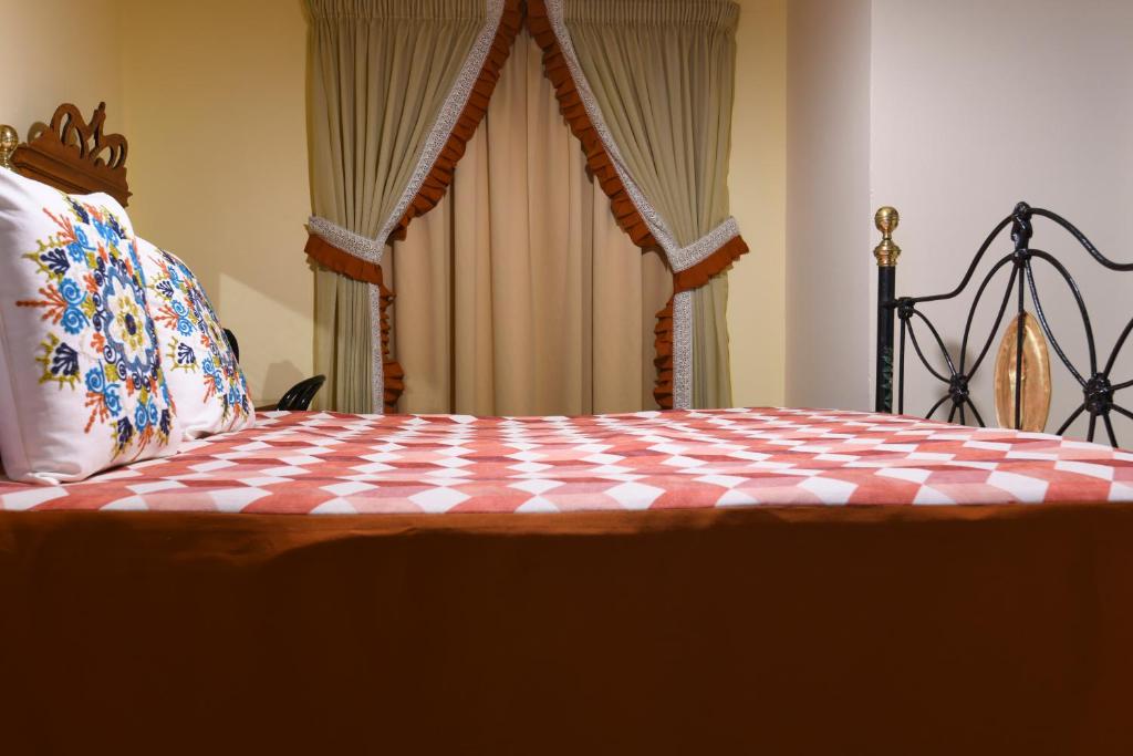 Ein Bett oder Betten in einem Zimmer der Unterkunft Maria Giovanna Guest House