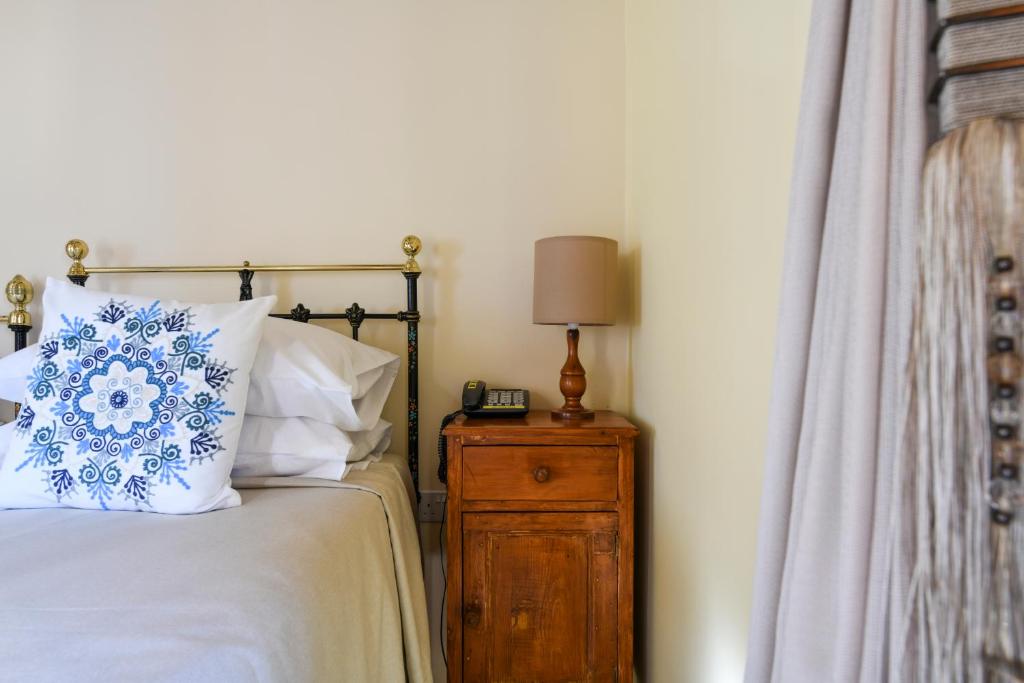 Ein Bett oder Betten in einem Zimmer der Unterkunft Maria Giovanna Guest House