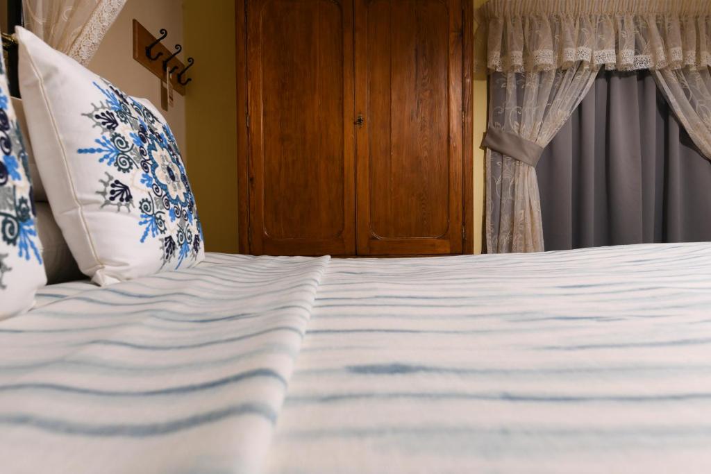 Ein Bett oder Betten in einem Zimmer der Unterkunft Maria Giovanna Guest House