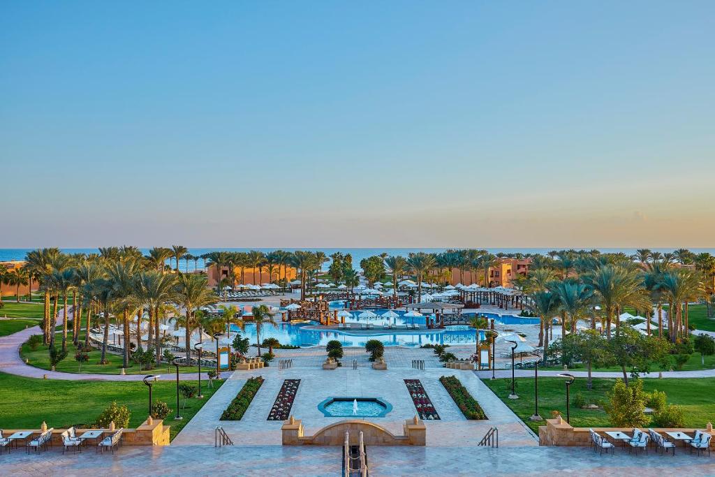 an aerial view of a resort with a swimming pool at Jaz Grand Marsa in Coraya Bay