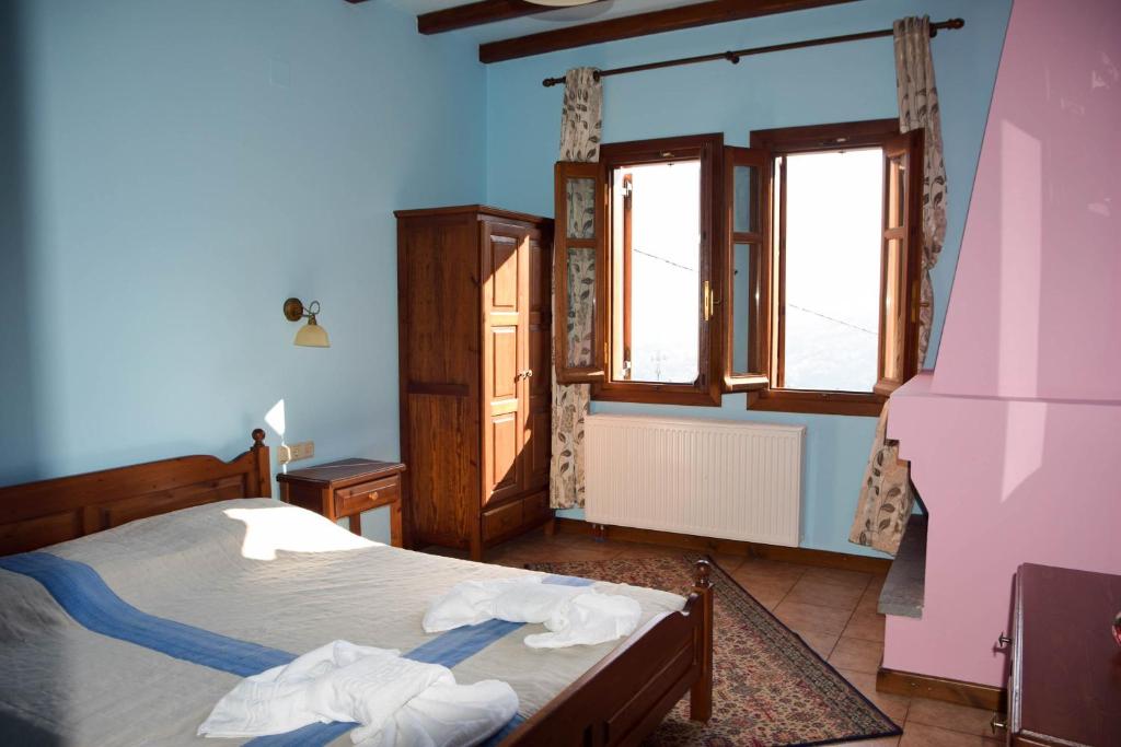 Postel nebo postele na pokoji v ubytování Aegean House