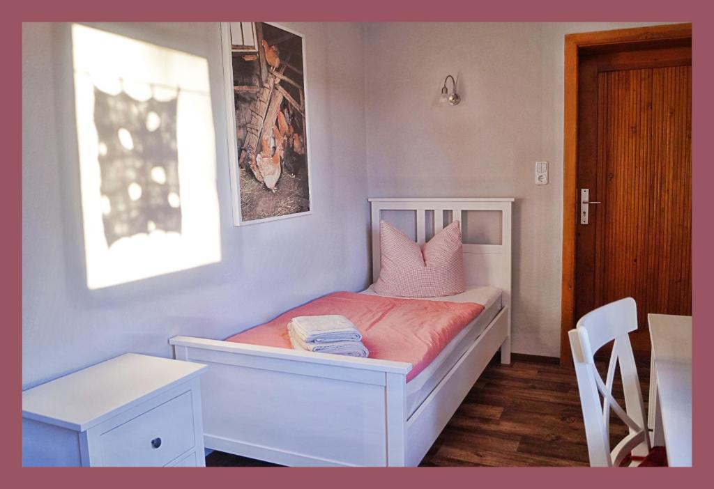 Postel nebo postele na pokoji v ubytování Alte Scheune Flemmingen