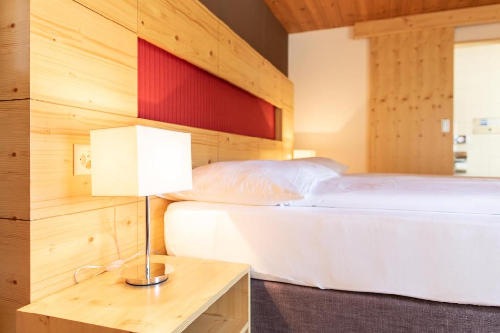 Postel nebo postele na pokoji v ubytování Meisser Lodge