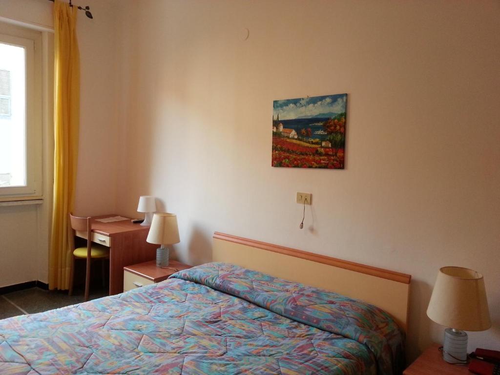 Postel nebo postele na pokoji v ubytování Hotel Mignon Posta