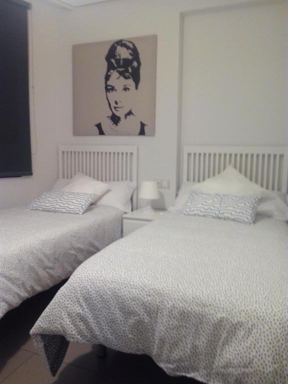 Postel nebo postele na pokoji v ubytování PATACONA MARE NOSTRUM APARTMENT