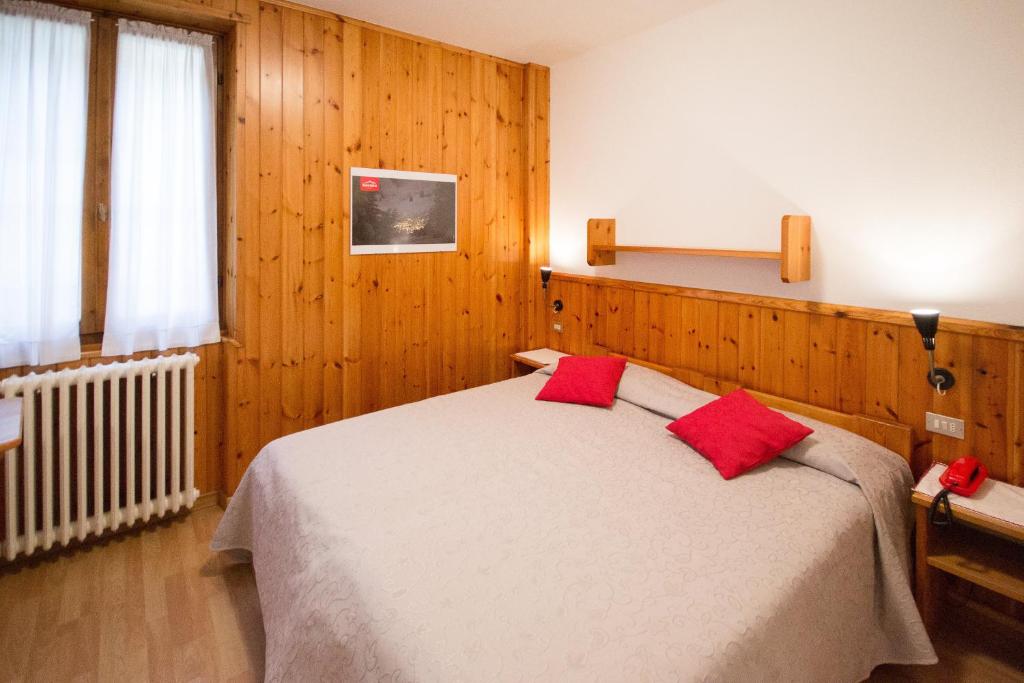 Postel nebo postele na pokoji v ubytování Meublé Albergo Dante