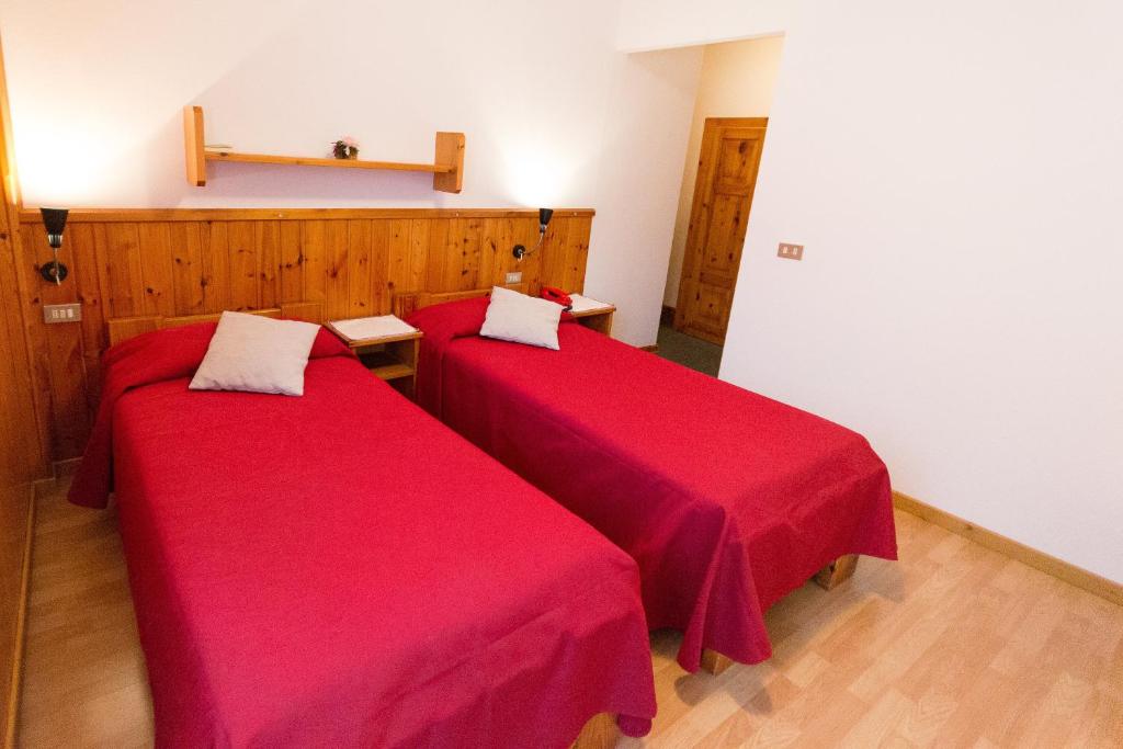 Postel nebo postele na pokoji v ubytování Meublé Albergo Dante