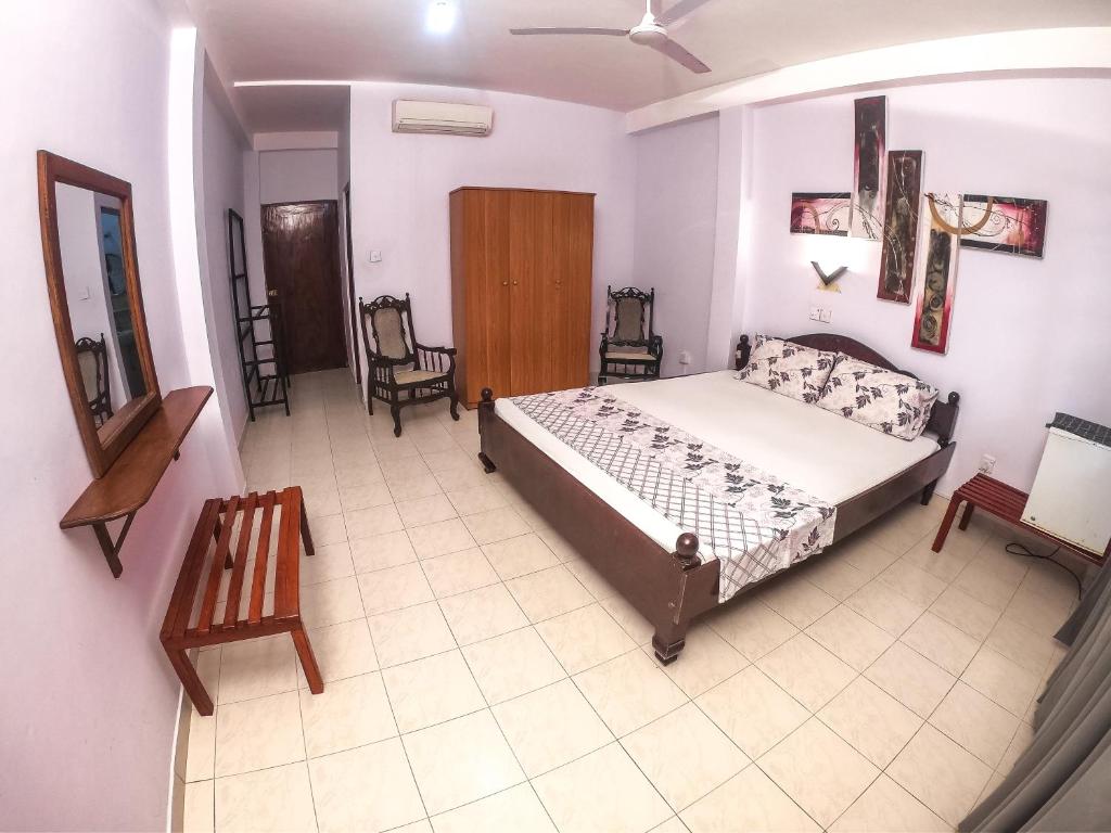 Katil atau katil-katil dalam bilik di Hotel Apollo
