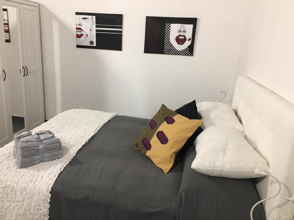 Un pat sau paturi într-o cameră la Palummelle