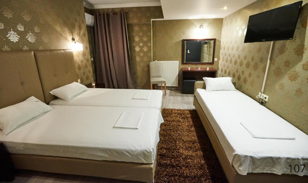 Postel nebo postele na pokoji v ubytování Atlantic Hotel