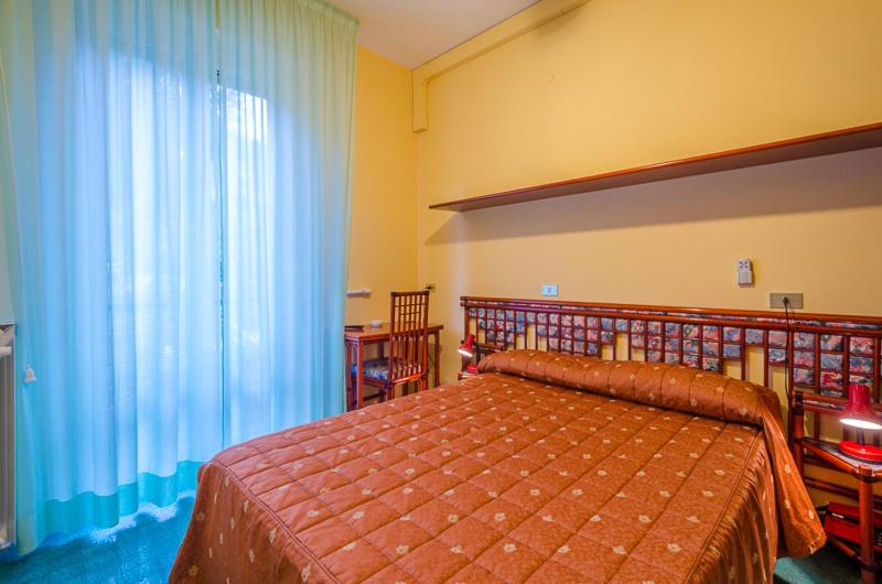 Postel nebo postele na pokoji v ubytování Hotel 5 Terre