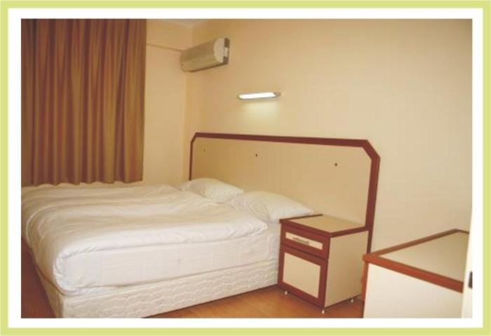 Postel nebo postele na pokoji v ubytování Zeytin Apart Hotel