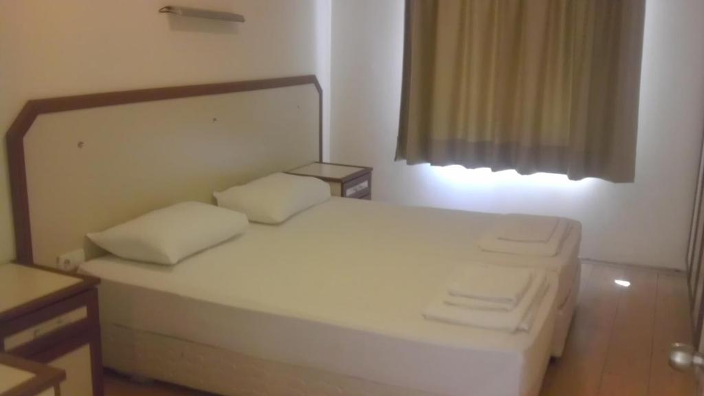 Postel nebo postele na pokoji v ubytování Zeytin Apart Hotel