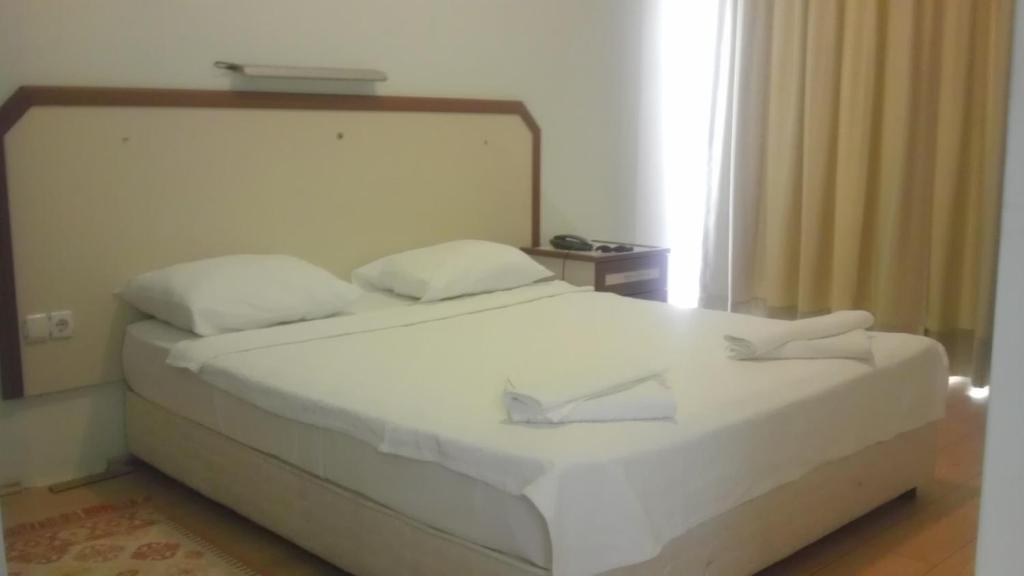 Postel nebo postele na pokoji v ubytování Zeytin Apart Hotel