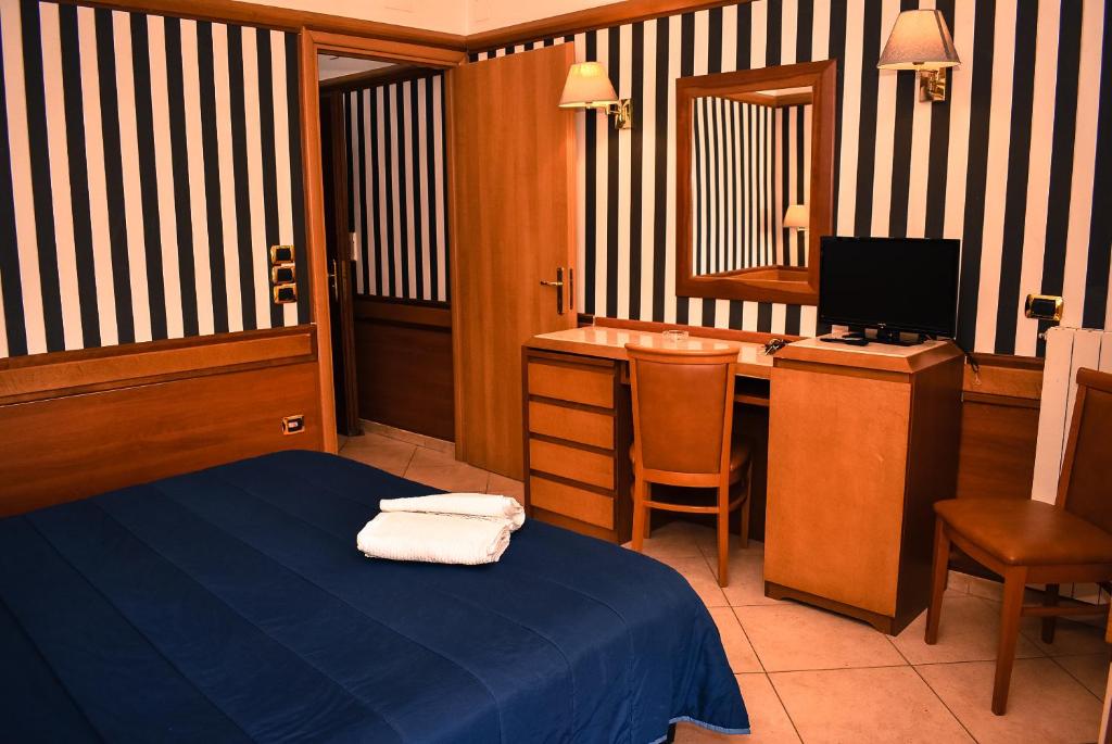 Postel nebo postele na pokoji v ubytování Hotel Miravalle