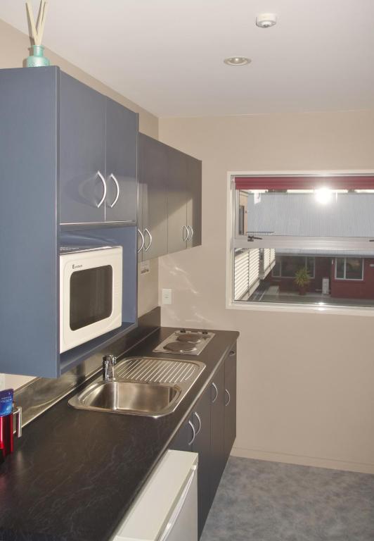 Kuchyň nebo kuchyňský kout v ubytování Phoenix Motels