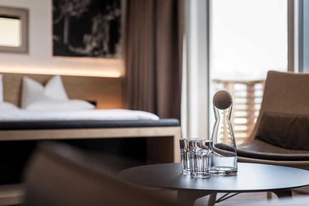 Łóżko lub łóżka w pokoju w obiekcie Alpin & Stylehotel Die Sonne