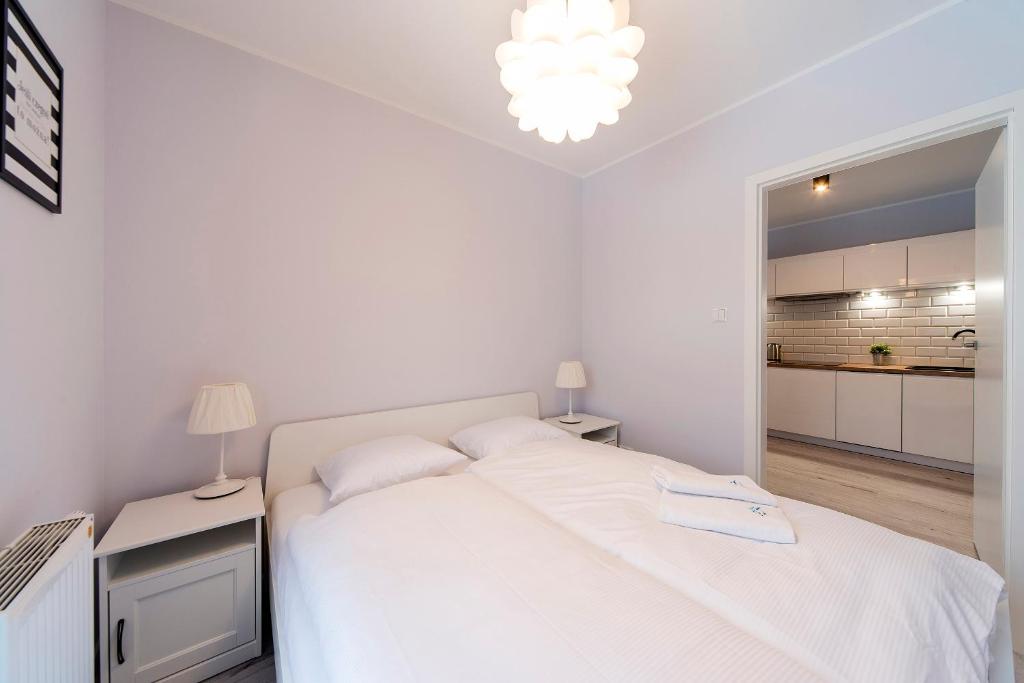 Łóżko lub łóżka w pokoju w obiekcie Apart-Invest Apartament Oslo