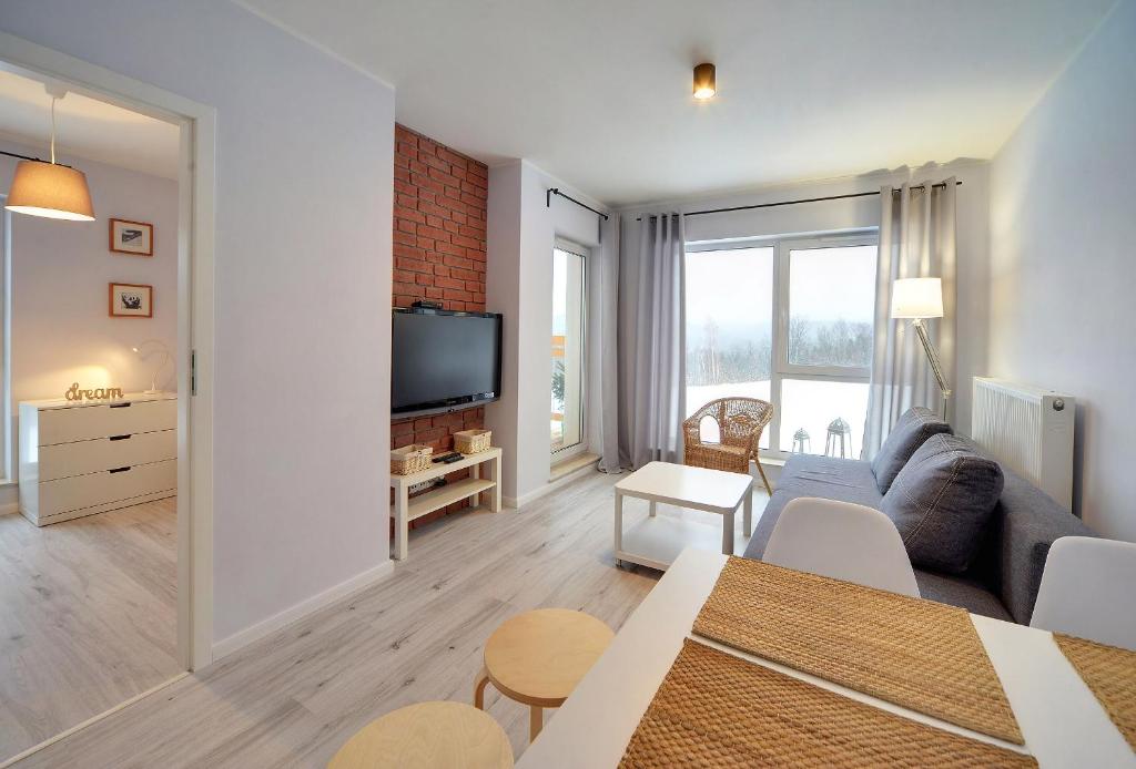 Telewizja i/lub zestaw kina domowego w obiekcie Apart-Invest Apartament Oslo
