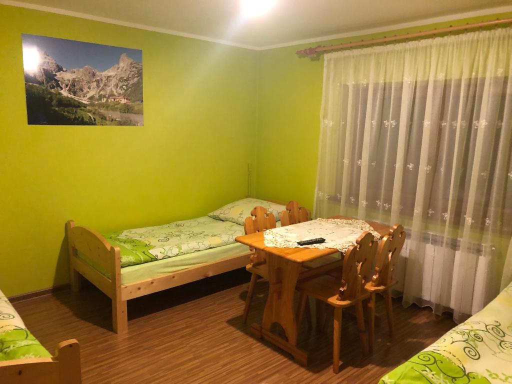 Posteľ alebo postele v izbe v ubytovaní Pokoje Gościnne Pod Gubałówką