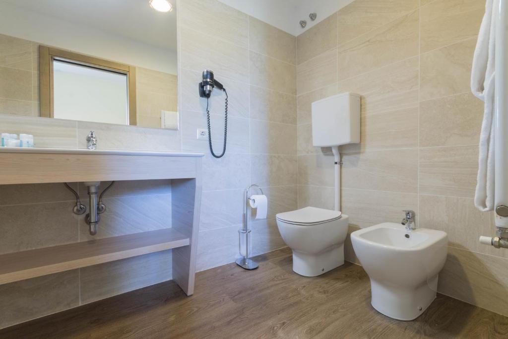 Koupelna v ubytování Hotel Capo Reamol