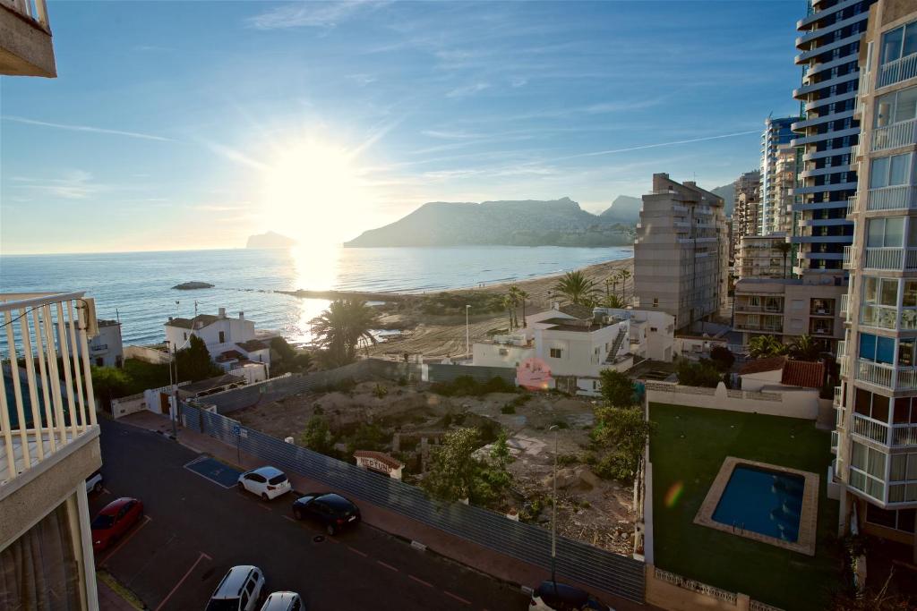 a view of the ocean from a city at Hernando Sea Front Optic Fiber Internet Apartment in Calpe