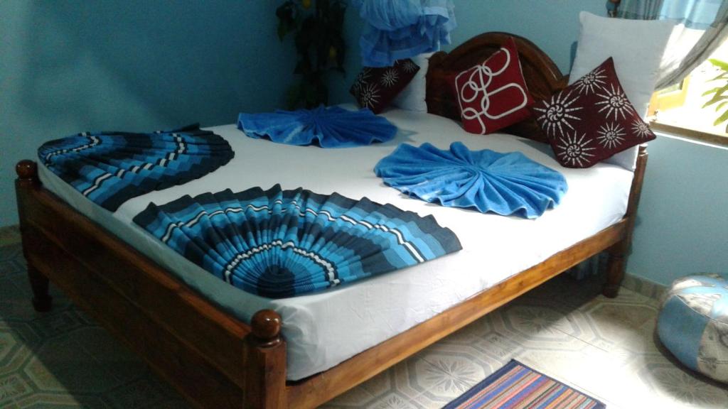 Postel nebo postele na pokoji v ubytování Flower Inn