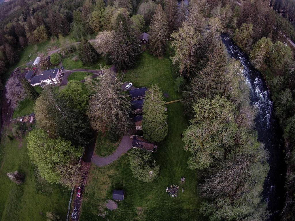 an aerial view of a park with trees and a road at The Cabins at Beaver Creek in Beaver