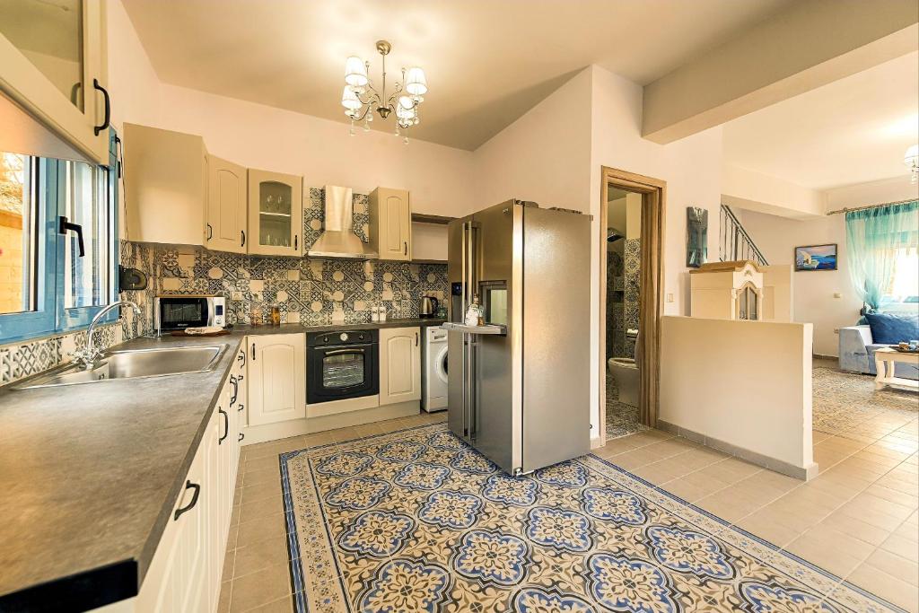 Kuchyň nebo kuchyňský kout v ubytování Lindos Luxury Retro Villas