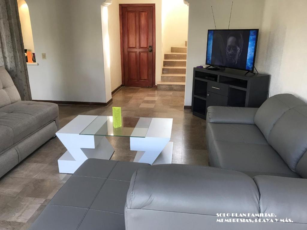 Posezení v ubytování Villa Privada ubicada en el campo de Golf del Hotel Vidanta Mayan Palace