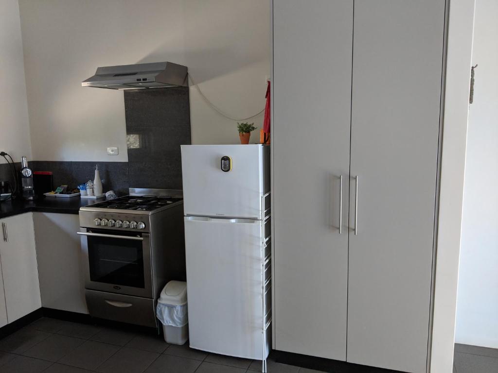 Kuchyň nebo kuchyňský kout v ubytování Hanover Bay Apartments