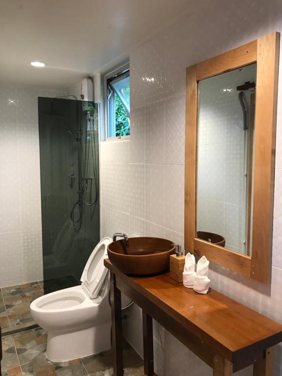 a bathroom with a sink and a toilet and a shower at 88 Homestay in Bang Chak