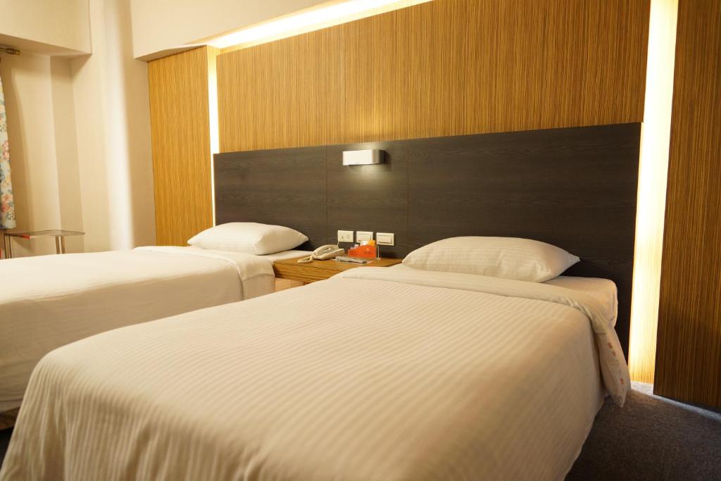 Postel nebo postele na pokoji v ubytování Ying Dai Hotel
