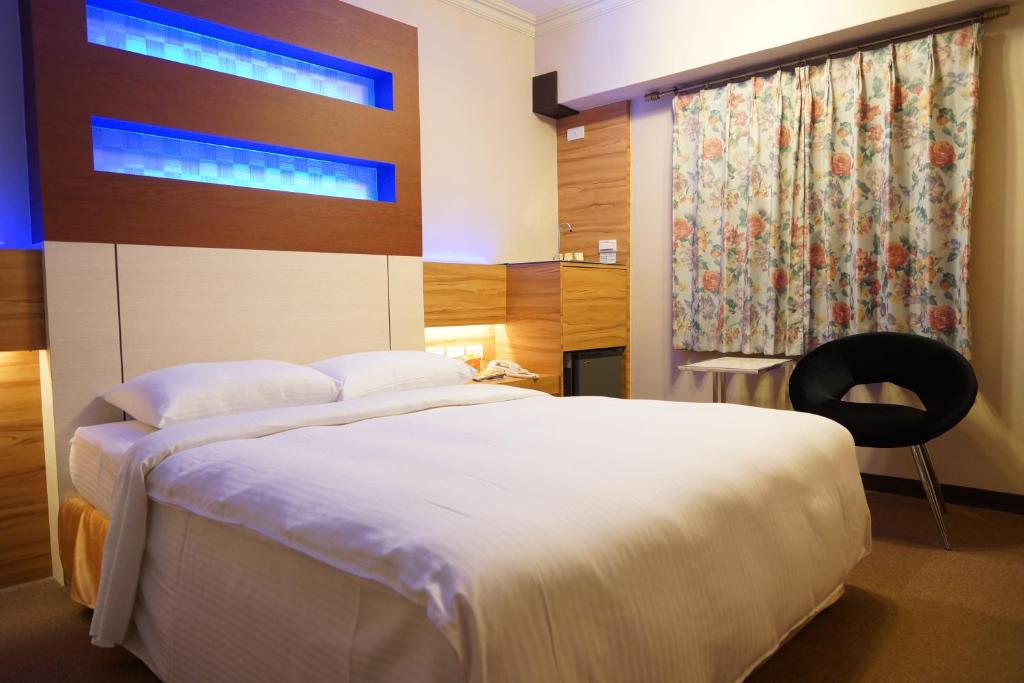 Postel nebo postele na pokoji v ubytování Ying Dai Hotel