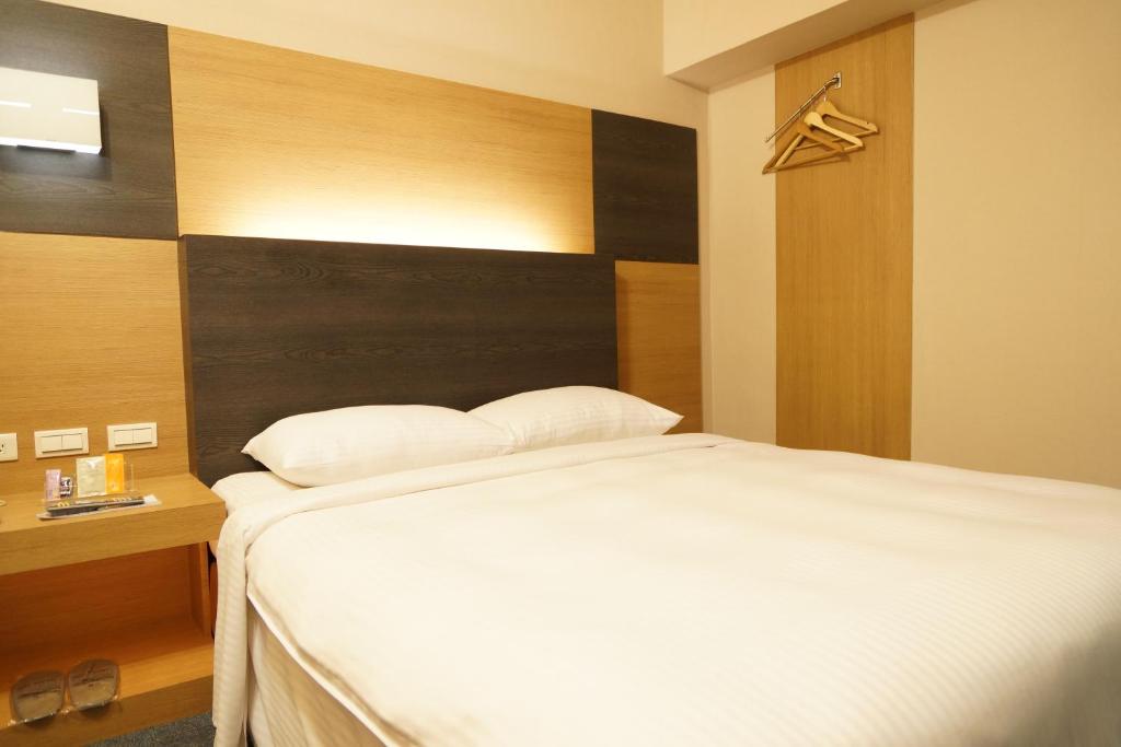 Postel nebo postele na pokoji v ubytování Ying Dai Hotel