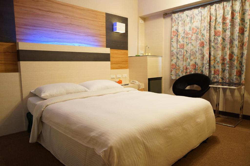 Postel nebo postele na pokoji v ubytování Ying Dai Hotel