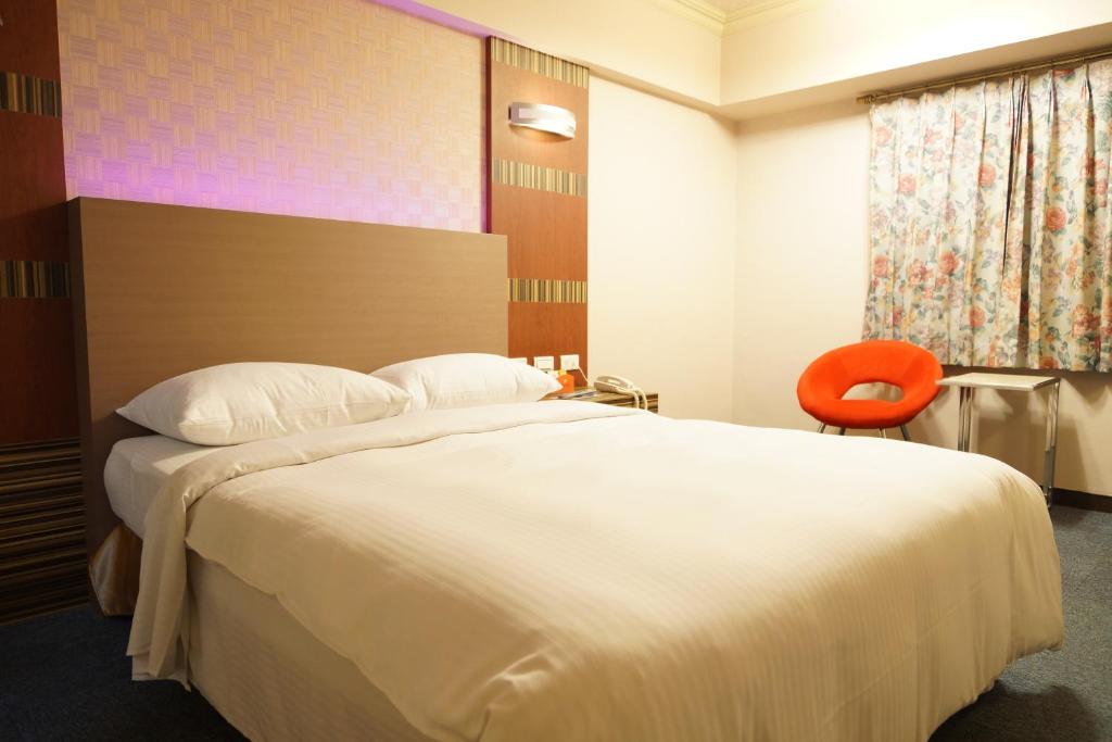 Postel nebo postele na pokoji v ubytování Ying Dai Hotel