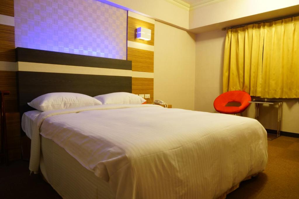 Postel nebo postele na pokoji v ubytování Ying Dai Hotel
