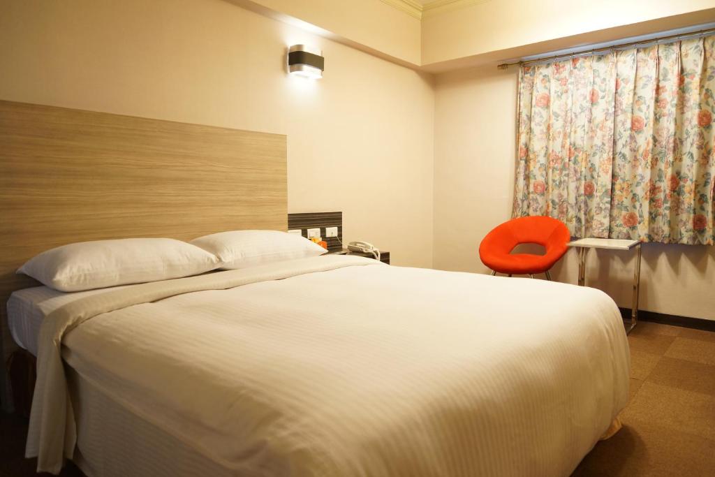 Postel nebo postele na pokoji v ubytování Ying Dai Hotel