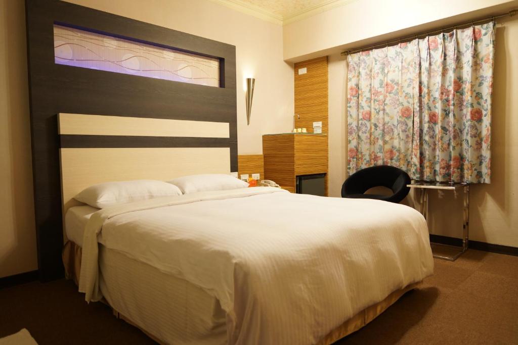 Postel nebo postele na pokoji v ubytování Ying Dai Hotel