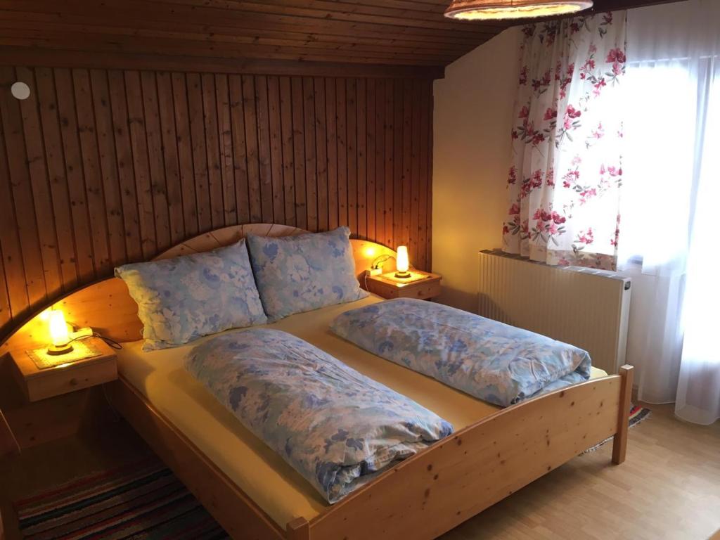 a bedroom with a bed with two pillows on it at Mitterhaidgut in Hollersbach im Pinzgau