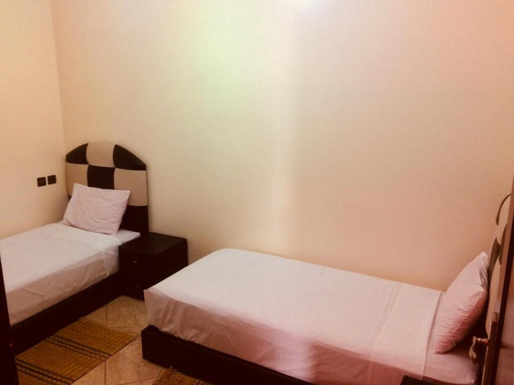 Una cama o camas en una habitación de ITRANE GUEST HOUSE