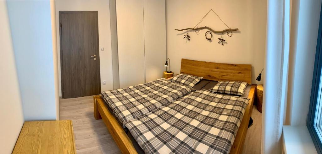 Postel nebo postele na pokoji v ubytování Apartmány BD Boží Dar