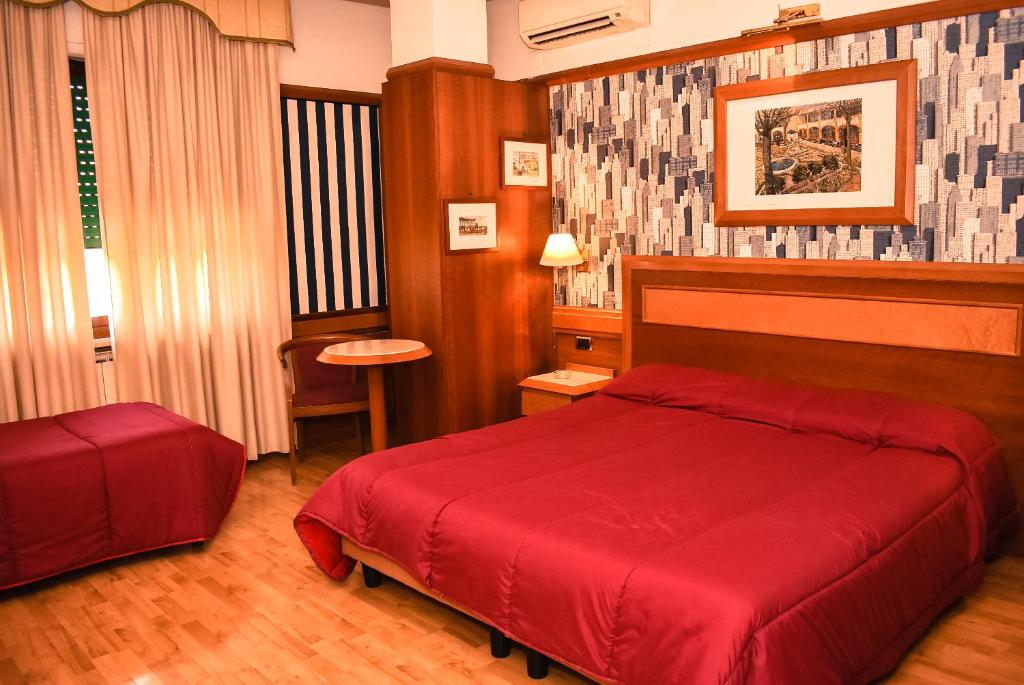 Postel nebo postele na pokoji v ubytování Hotel Miravalle