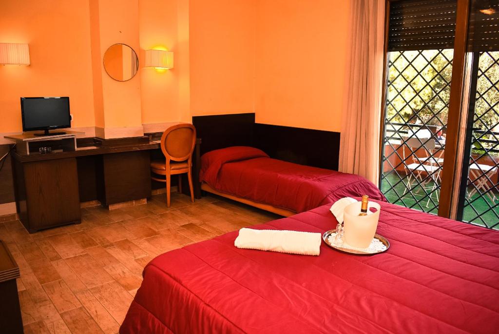Postel nebo postele na pokoji v ubytování Hotel Miravalle