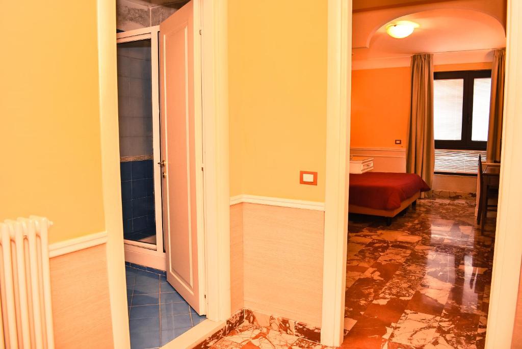 Postel nebo postele na pokoji v ubytování Hotel Miravalle
