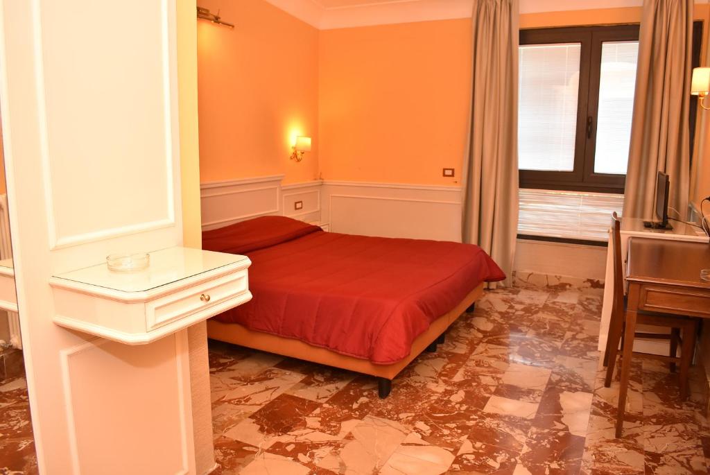 Postel nebo postele na pokoji v ubytování Hotel Miravalle
