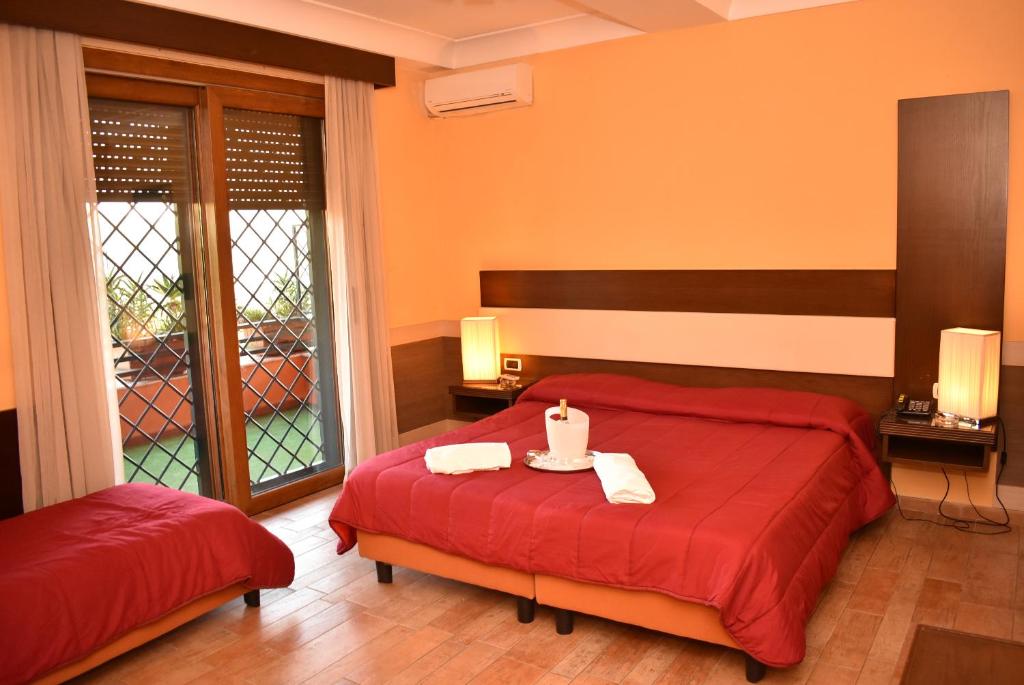 Postel nebo postele na pokoji v ubytování Hotel Miravalle