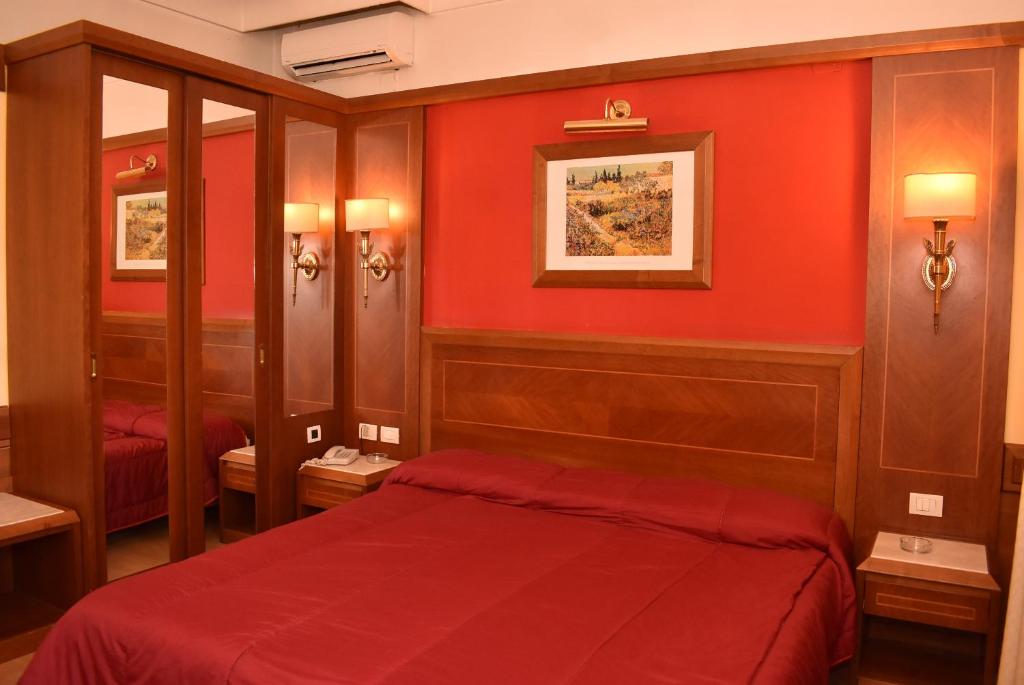 Postel nebo postele na pokoji v ubytování Hotel Miravalle