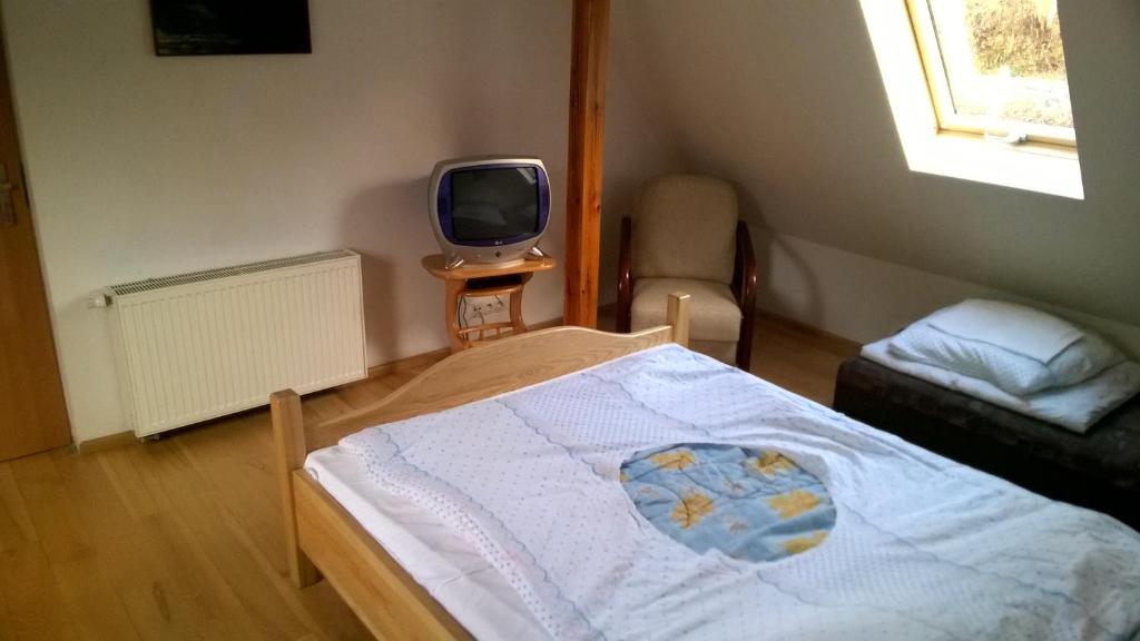 Posteľ alebo postele v izbe v ubytovaní Dom nad potokiem